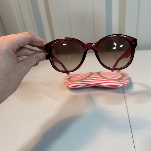 Pink women’s Lacoste sunglasses with pink striped carrying pouch main image 6